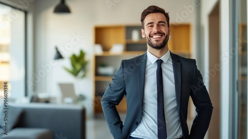 Young man smiling in office.