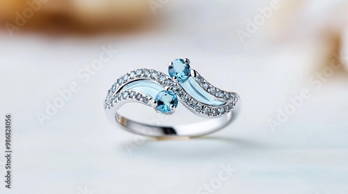 Wave-pattern ring with aquamarine stones, capturing oceanic beauty