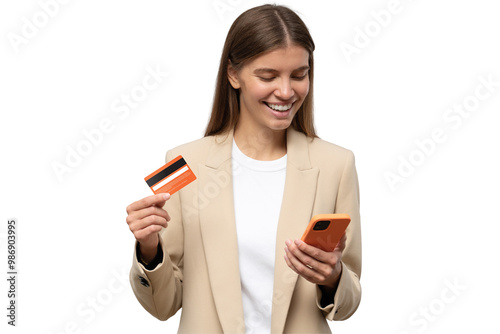 Happy office manager shopping online, browsing web stores, buying annual mobile app membership spending her salary holding orange credit card in hand