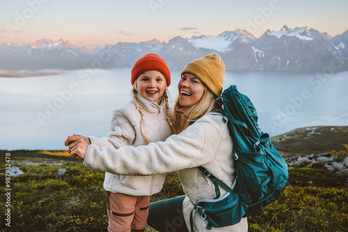 Mother and child daughter laughing having fun outdoor family hiking together travel lifestyle active vacations, woman with backpack playing with kid in mountains candid emotions, Mothers day holiday