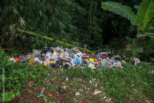 Piles of rubbish dumped in rice fields and bamboo forests, an irresponsible act, trash, garbage