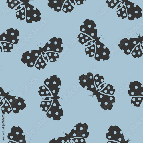 Black butterflies with polka dots. Seamless pattern on blue background. Vector design for print, textile, cover, wallpaper.