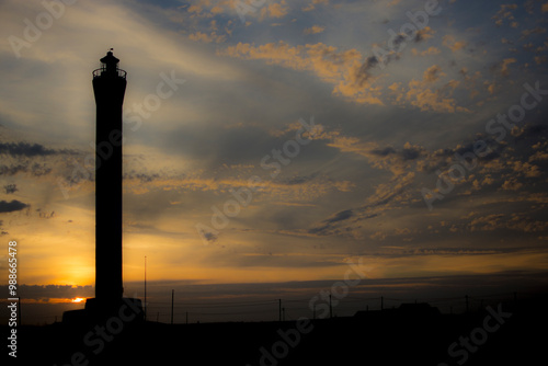 Dungeness lighthouse silhouette at sunset