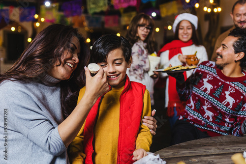 Mexican Family celebrating traditional party or posadas for Christmas eve and holidays in Mexico Latin America