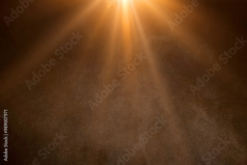 orange spotlight on stage or gods rays isolated on black background