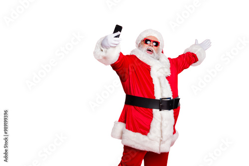 Portrait of his he nice attractive cheerful cheery positive glad friendly hospitable bearded Santa pouted lips taking making selfie blog blogger isolated over bright vivid shine red background