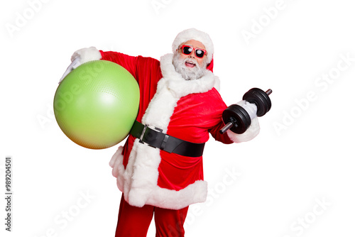 Portrait of excited christmas father in eyewear eyeglasses practice fitness with dumbbells fitball isolated over red background