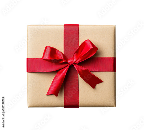 Top view of Christmas gift box wrapped in brown craft paper and red ribbon isolated on white or transparent background