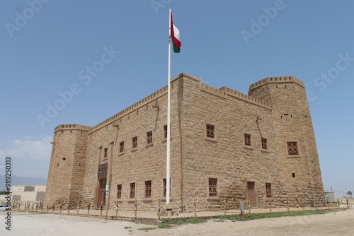 mirbat fort on the sea in sultanate of oman with blue sky , old building