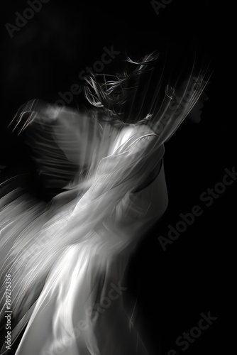 Abstract Motion Blur of a Woman in Flowing Dress with Dark Background