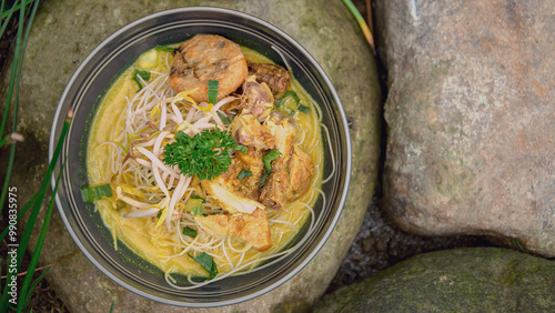 Chicken soto is typical comfortable asian dish. Served with vermicelli, beans sprout, potato croquette, spring onion, chicken, beef, sometime with eggs.