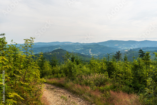 View from hiking trail bellow Wielki Stozek hill summit in summer Beskid Slaski mountains in Poland near borders with Czech republic