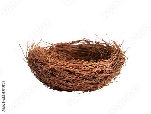 a brown bird nest on a white surface