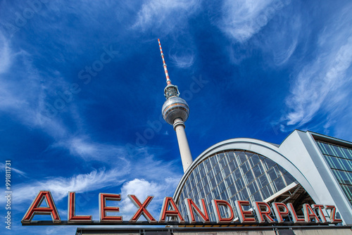 Alexanderplatz Station Sign With TV Tower Under a Bright Sky in Berlin