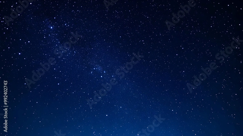 A Deep Blue Night Sky Filled with a Myriad of Tiny Twinkling Stars, Creating a Beautiful and Tranquil Cosmic Background