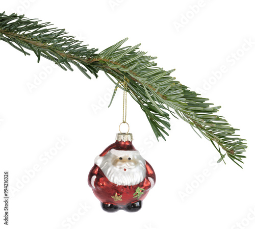 Boule de Noël en forme de père noël accrochée à une branche de sapin