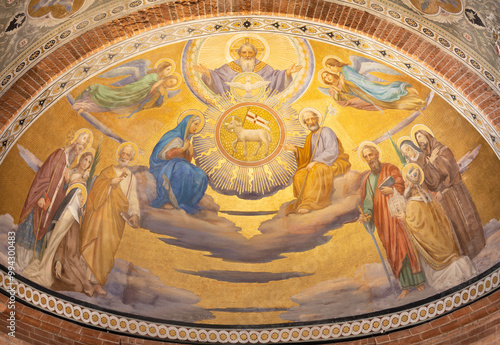 PAVIA, ITALY - SEPTEMBER 9, 2024: The fresco of Holy Trinity among the saints in the main apse of church Chiesa di San Teodoro.