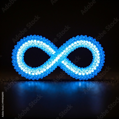 Blue dots forming an infinity symbol on a black background.