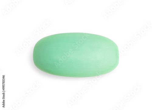 Elevated top view of single dry hygienic handmade natural antibacterial soap bar of green colour isolated on white background used as toiletries cosmetics for skin and body care for bath and shower