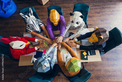 High angle view photo of rooster gorilla lion sloth zebra raccoon mask people pile stack handshake loft interior office indoors