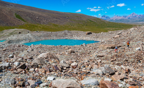 High mountain turquoise moraine lake high in the mountains among the rocks.