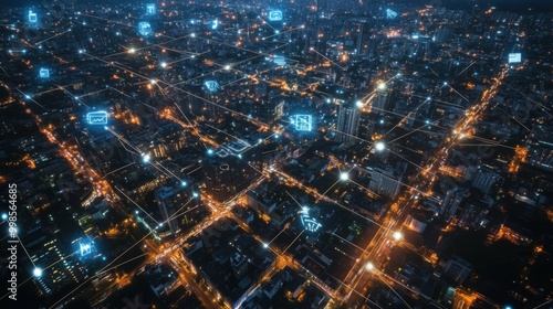 An aerial view of a smart city at night, with a glowing web of wireless connections represented by bright lines linking buildings, cars, and devices across the cityscape.