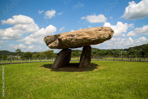 A dolmen on green lawn against blue sky at Bugeun-ri near Ganghwa-gun, South Korea