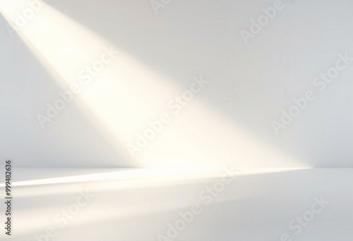 White wall with soft light streaks and shadow.