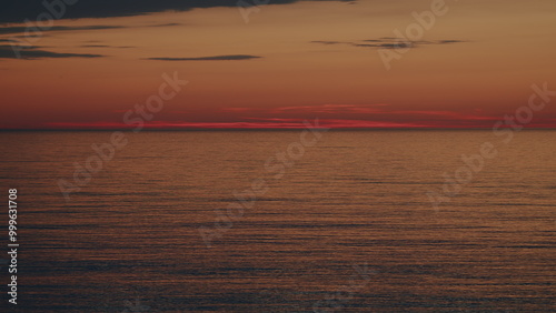 Yellow And Orange Sea At Sunset. Golden Texture Water Surface Small Waves. Sunset Reflections On Sea Surface.