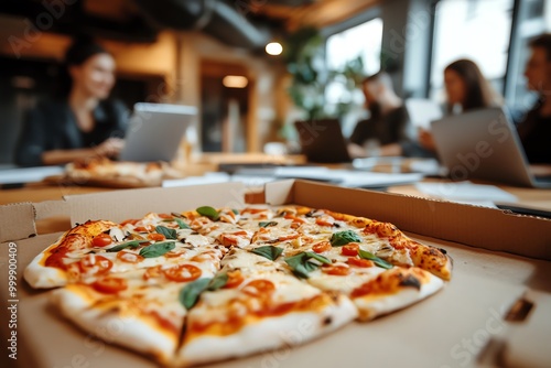 A delicious pizza topped with fresh ingredients, enjoyed during a team meeting in a modern office setting.