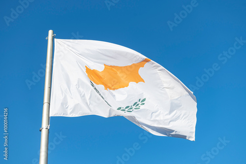 Flag of Cyprus flying in the wind with a blue sky background...country, land, cypriot