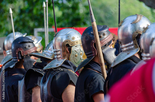 Reenactors as roman legionaries in formation at a historical party about ancient Rome