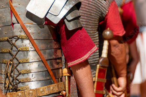 detail of an ancient roman soldiers, roman legionnaires in metal armor at a historical festival