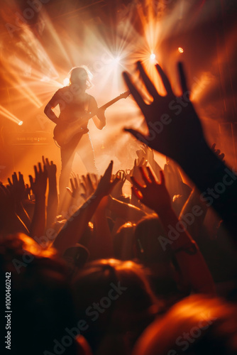 Silhouette of hard rock guitarist performing with energy, crowd, and passion at a live concert