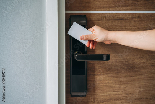 Electronic card key for open door in hotel. Smart card key to lock and unlock door. Security systems and protection concept.