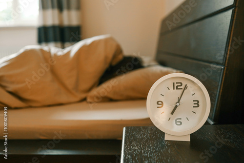 Alarm clock and person in the background, sleep