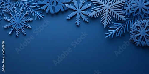 Blue snowflakes and pine branches on a blue background