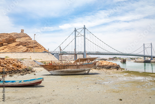 Al Ayjah bridge and traditional omani wooden dhow boats on a seashore, Sur, sultanate Oman