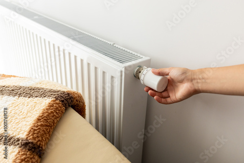 modern radiator for heating in the apartment with power regulators. ideal for those costs of heating and utilities in winter, person a person regulates the level of heat