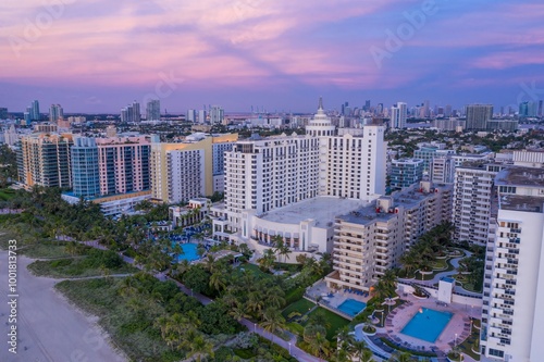 Beach front of art deco hotels and condos at sunrise. Miami Beach, Miami, Florida, United States.