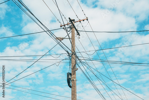 Concrete electrical post with cables and wires spreading in all directions