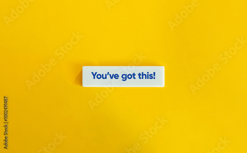 You’ve got this. Motivational Statement, Message, or Slogan. Blue Text on Block Letter Tile on Yellow Background.