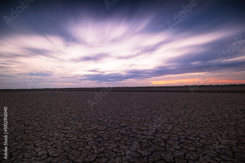 Arid landscape,Dry barren land with cloudy polluted sky, climate change and desertification concept