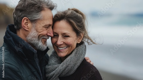 Joyful middle aged couple, a man and woman, sharing a loving hug on a beach, generative ai