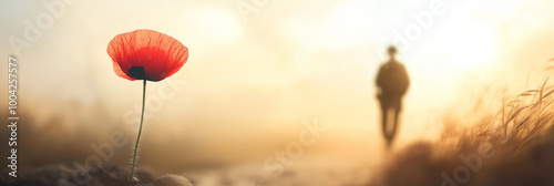 A solitary red poppy stands against a softly blurred background, with a faint soldier's silhouette in the distance, evoking peace, honor, and remembrance for Armistice Day.