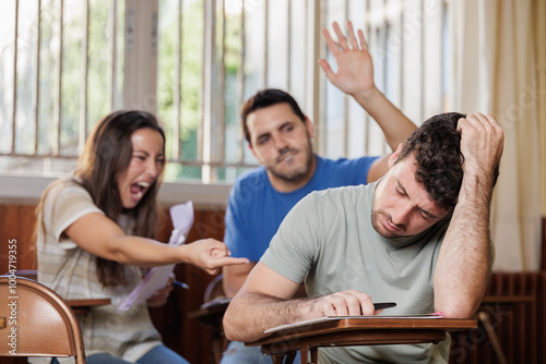 Bullying situation. Two students are laughing at a classmate while they are in class. No to bullying. Reporting bad behavior, do not act as an accomplice.