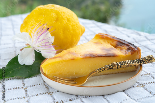 Summer time in Provence, flan dessert with lemon and blue sea view on background, French Riviera near Monaco and Menton, south of France