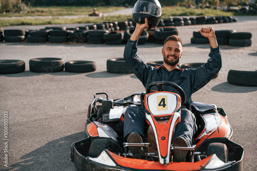 Man is outdoors, kart racing conception