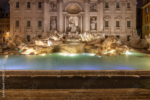 The Trevi Fountain, one in the morning at blue hour. No people but well lit. Monumental fountain in the Piazza di Trevi in ​​front of the Palazzo Poli. Fontana di Trevi, Rome, Italy