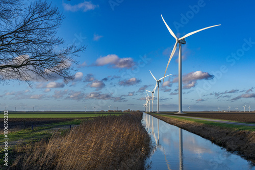 Windmills in the Polder to generate electricity. In many places the horizon is full of wind turbines to keep pace with energy progress. There is always wind (energy) in Dutch polders.